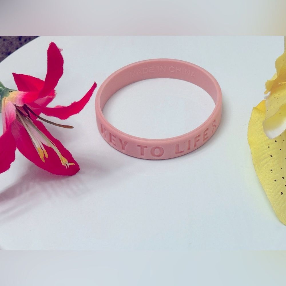 Never worn! “Key to Life” pink ribbon bracelet!